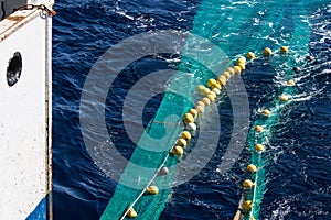 Hauling otter trawl fishing nets