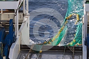 Hauling otter trawl fishing nets