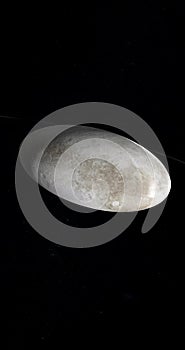 Haumea, dwarf planet, rotating in the outer space. 3d render