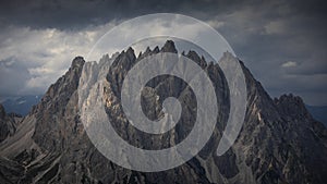 Haunold mountain chain with dark clouds during sunset at Three Peaks Hut in the Dolomite Alps in South Tyrol