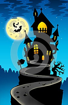 Haunted house on hill with Moon