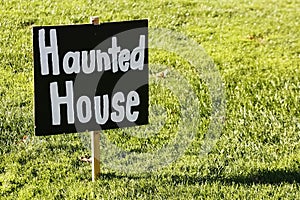 Haunted house sign in a sunny day