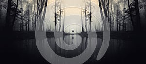 Haunted lake in forest with man silhouette