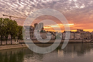 Haussmann buildings along the Seine river and Notre Dame cathedral Towers in background in Paris