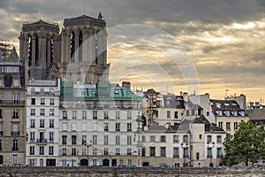 Haussmann buildings along the Seine river and Notre Dame cathedral Towers in background in Paris