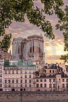 Haussmann buildings along the Seine river and Notre Dame cathedral Towers in background in Paris