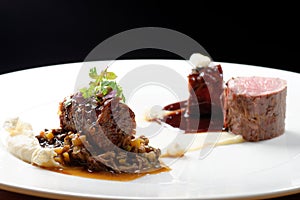 Haute cuisine, grilled veal fillet steak,veal tail with a sauce of port, morels, lentils