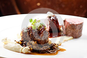 Haute cuisine, grilled veal fillet steak,veal tail with a sauce of port, morels, lentils