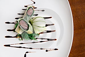 Haute high end cuisine Crunchy tuna spring roll with cucmber ice
