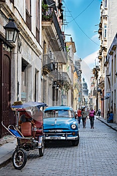 Havana, classic car in small street with view to Capitolio, Cuba