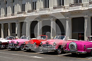 Havana, Cuba - August 26 2018: Next to the Manzana Kempiski hotel in Old Havana there are many classic cars of different brands an