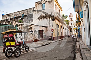 Havana, Cuba - December 12, 2016: Street to the Plaza de la Cathedral in Old Havana (Cuba) with the baroque architecture of San C