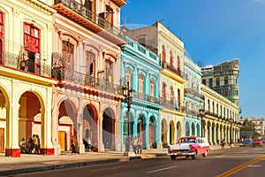 Classic old cars and colorful buildings in downtown Havana