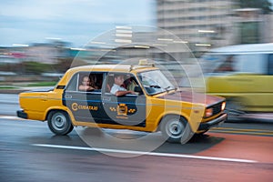 HAVANA, CUBA - OCTOBER 20, 2017: Havana Old Town and Malecon Area with Old Taxi Lada Vehicle. Cuba. Panning.