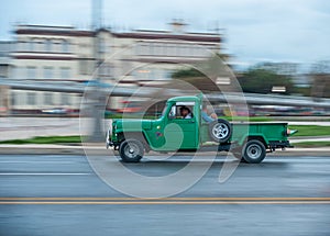 HAVANA, CUBA - OCTOBER 20, 2017: Havana Old Town and Malecon Area with Old Taxi Truck Vehicle. Cuba. Panning.