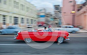 HAVANA, CUBA - OCTOBER 20, 2017: Havana Old Town and Malecon Area with Old Taxi Vehicle. Cuba. Panning.