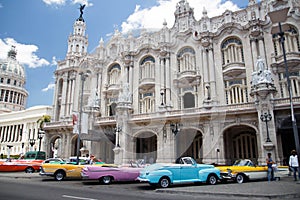 Havana, Cuba. View of vintage cars and old building near The Capitolio