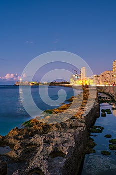 Havana at night - The castle of El Morro and the Havana seaside skyline