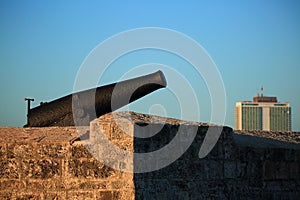 Havana. Old cannon and fortress wall against the background of the morning sky, close-up