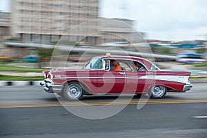 HAVANA, CUBA - OCTOBER 20, 2017: Havana Old Town and Malecon Area with Old Taxi Vehicle. Cuba. Panning.