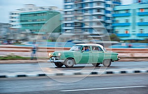 HAVANA, CUBA - OCTOBER 20, 2017: Havana Old Town and Malecon Area with Old Taxi Vehicle. Cuba. Panning.