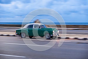 HAVANA, CUBA - OCTOBER 20, 2017: Havana Old Town and Malecon Area with Old Taxi Vehicle. Cuba. Panning.