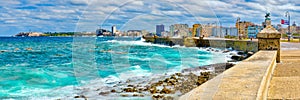 The Havana skyline and the iconic Malecon seawall with a stormy ocean