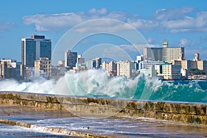 Havana skyline with waves crashing on the Malecon seawall