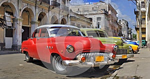 Havana street with colorful old cars in a raw