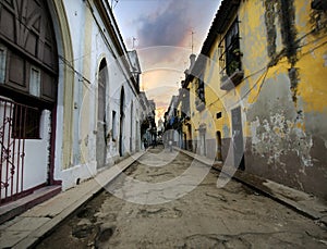 Havana street with eroded buildings photo