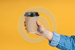 Have a break! Close-up photo of woman's hand holding paper cup of coffee take away