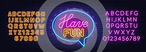 Have fun neon sign in the speech bubble on brick wall background.