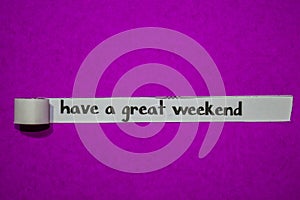 Have a great weekend, Inspiration, Motivation and business concept on purple torn paper photo