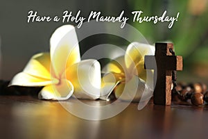 Have a Holy Maundy Thursday. Holy week concept. With Jesus Christ holy cross crucifix on wooden rosary beads the Catholic symbol. photo