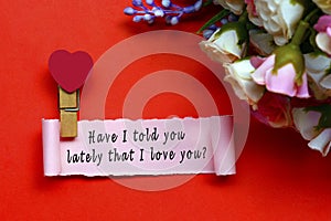 Have I told you lately that I love you label on torn paper on red background