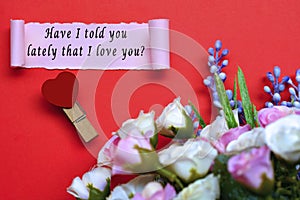 Have I told you lately that I love you label on torn paper on red background