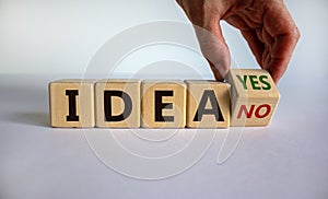 Have an idea. Hand turns a cube and changes the expression `idea no` to `idea yes`. Beautiful white background, copy space.