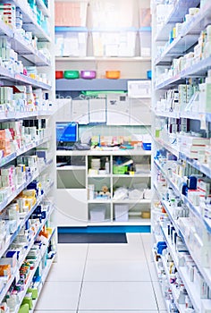 We have just the medicine for you. shelves stocked with various medicinal products in a pharmacy.