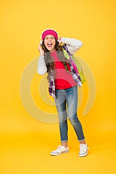 Have more fun in singing. Happy child sing song yellow background. Little girl enjoy singing. Headphones technology