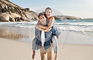 We always have so much fun at the beach. a middle aged couple spending the day at the beach.