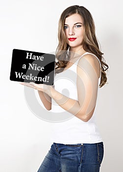 Have a nice weekend written on virtual screen. technology, internet and networking concept. beautiful woman with bare photo