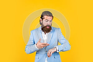 have no time. old fashioned bearded hipster watching time on luxury clock. time management concept. brutal handsome man