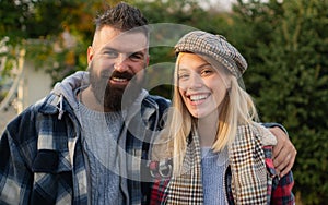 They have own style. Lumberjack style. Couple wear checkered clothes nature background. Man bearded hipster and girl