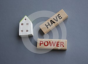 Have power symbol. Wooden blocks with words have power. Beautiful grey background. Business and have power concept. Copy space