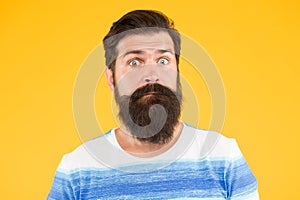 Have some doubts. Hipster bearded face not sure. Doubtful bearded man on yellow background close up. Doubtful expression