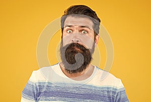 Have some doubts. Hipster bearded face not sure. Doubtful bearded man on yellow background close up. Doubtful expression