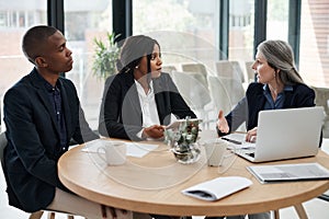 We have to put our time to better use. a group of businesspeople having a meeting in a modern office.