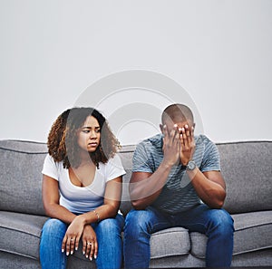 Have the walls closed in on their relationship. Shot of a young couple having relationship problems at home.