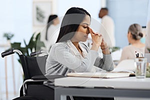 Having a bit of a bad day. an attractive young businesswoman looking stressed while working at her desk in the office.