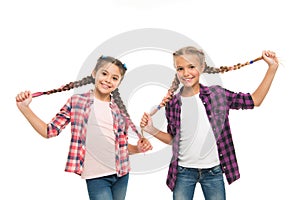 Having fun. Rebellious spirit. Hairstyles school style. Girls long braids. Fashion trend. Fashionable cutie. Happy